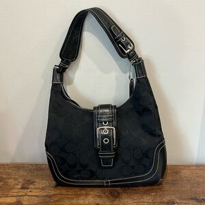 Women’s black Coach logo shoulder bag